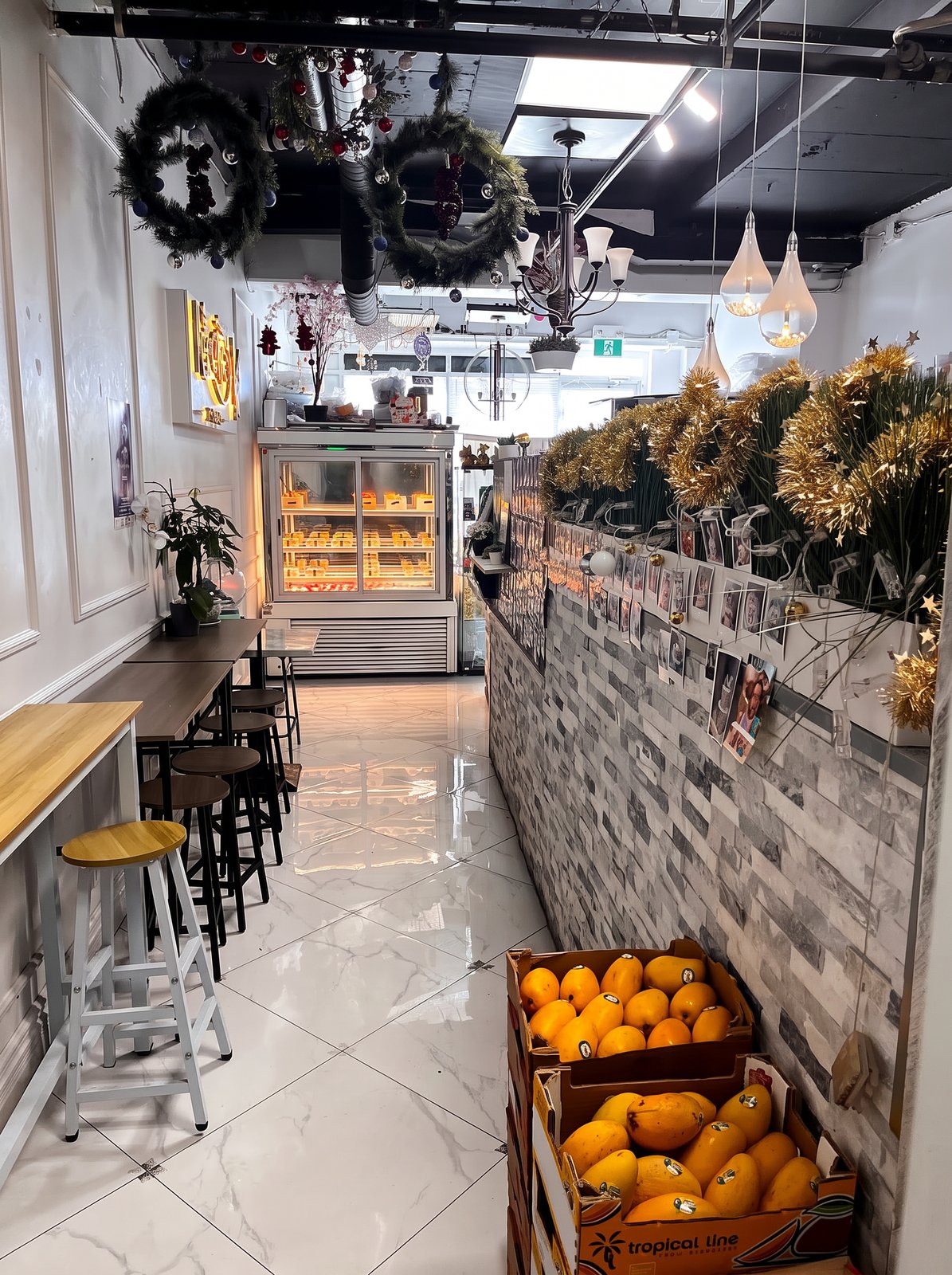 Bright interior with cake fridge and seating