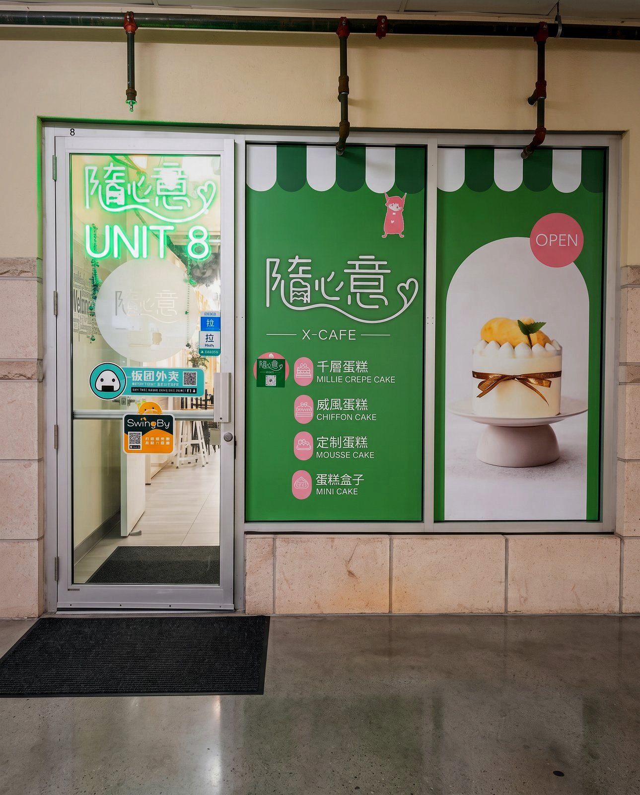 X-Cake green storefront at Unit 8